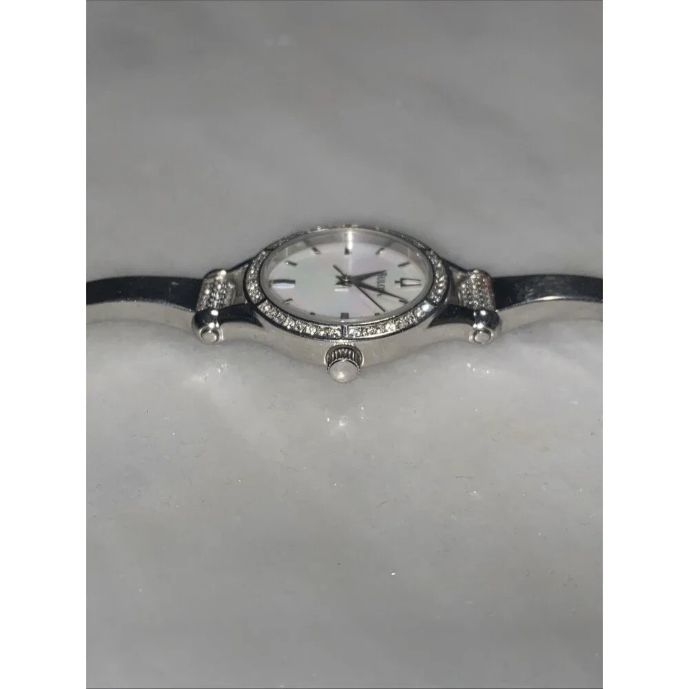 Bulova Women Silver Tone Crystal Bezel Mother Of Pearl Dial Bangle Watch C869915